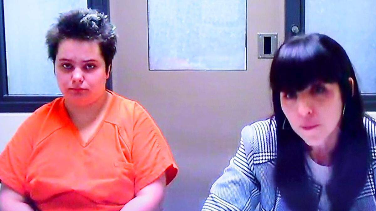 Amara Lundy, 23, left, appears in Thurston County Superior Court on Tuesday in connection with her mother’s death. Her defense attorney, right, is Angela Colaiuta.