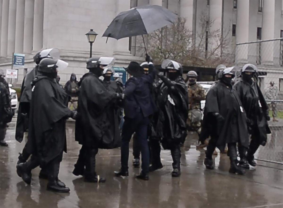 A man who insisted he would enter the Legislative Building when the Senate convened at 11 a.m. Monday was arrested outside the perimeter fencing.