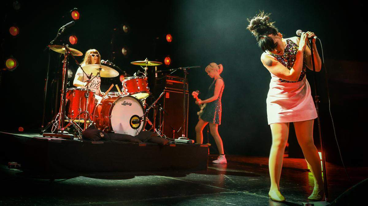 Bikini Kill performs at the Hollywood Palladium. Tobi Vail of Olympia is the drummer. Kathleen Hanna is the lead singer and Kathi Wilcox is the bassist.