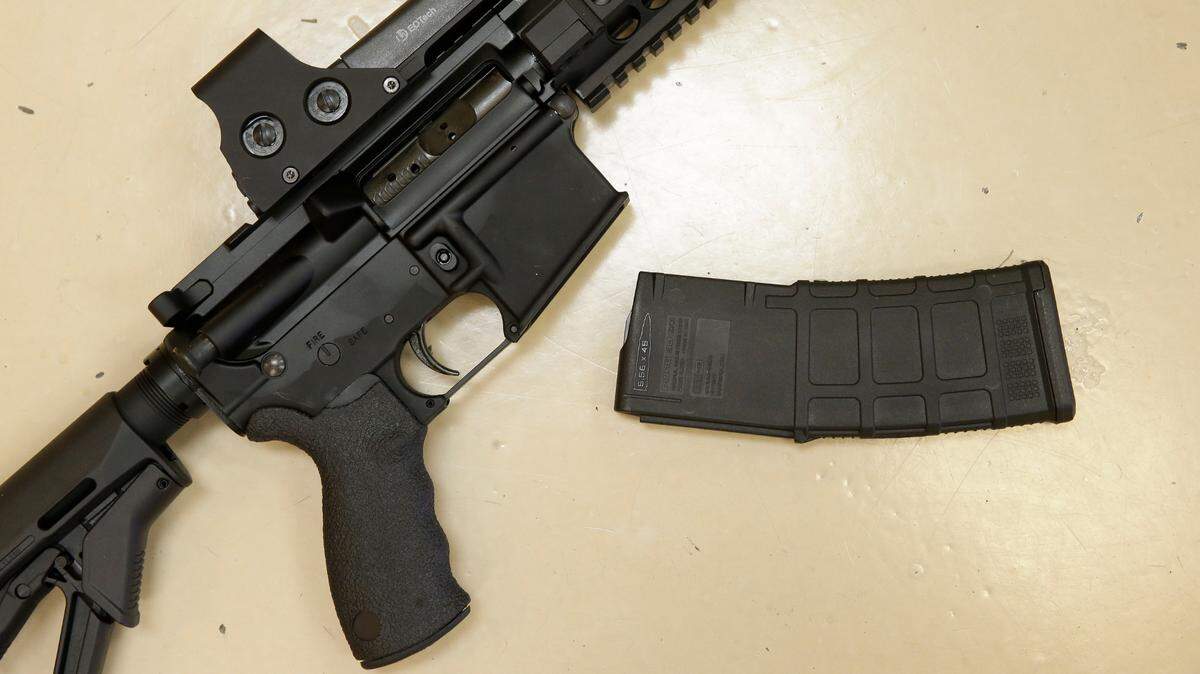 A custom-made semi-automatic hunting rifle with a high-capacity detachable magazine is displayed at TDS Guns in Rocklin, Calif., in 2013.