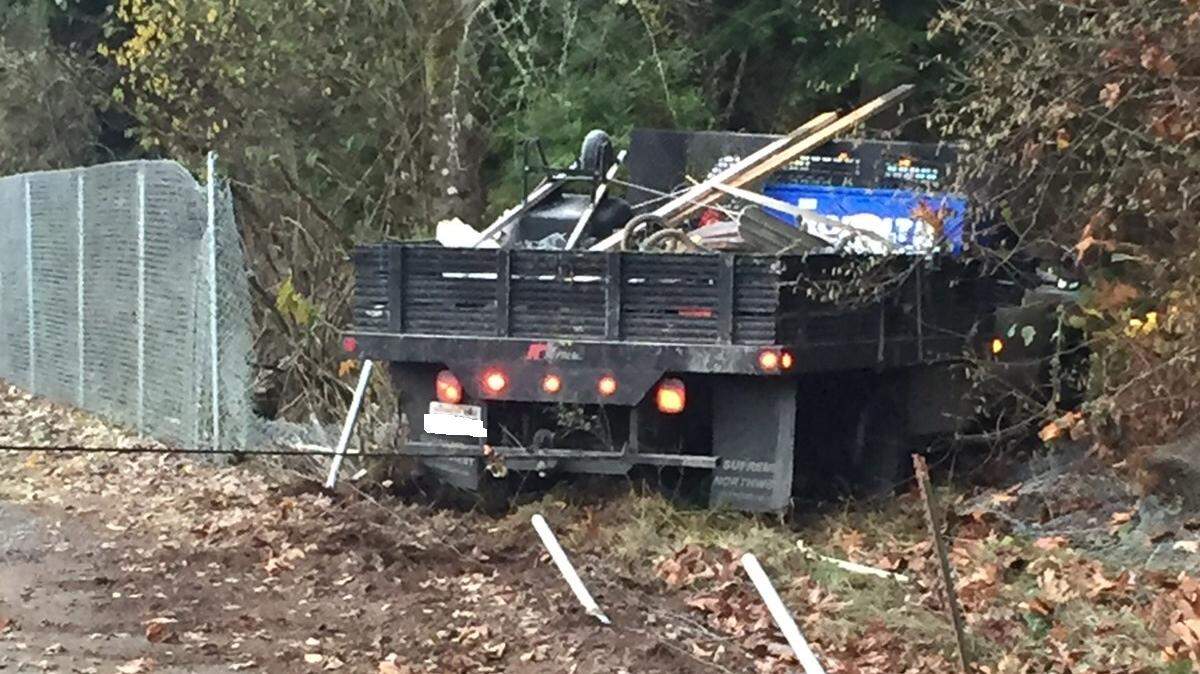 One suspect is in custody and one is still at large after two men allegedly stole a flatbed truck in Yelm Sunday morning, according to the Thurston County Sheriff’s Office, which assisted Yelm police.