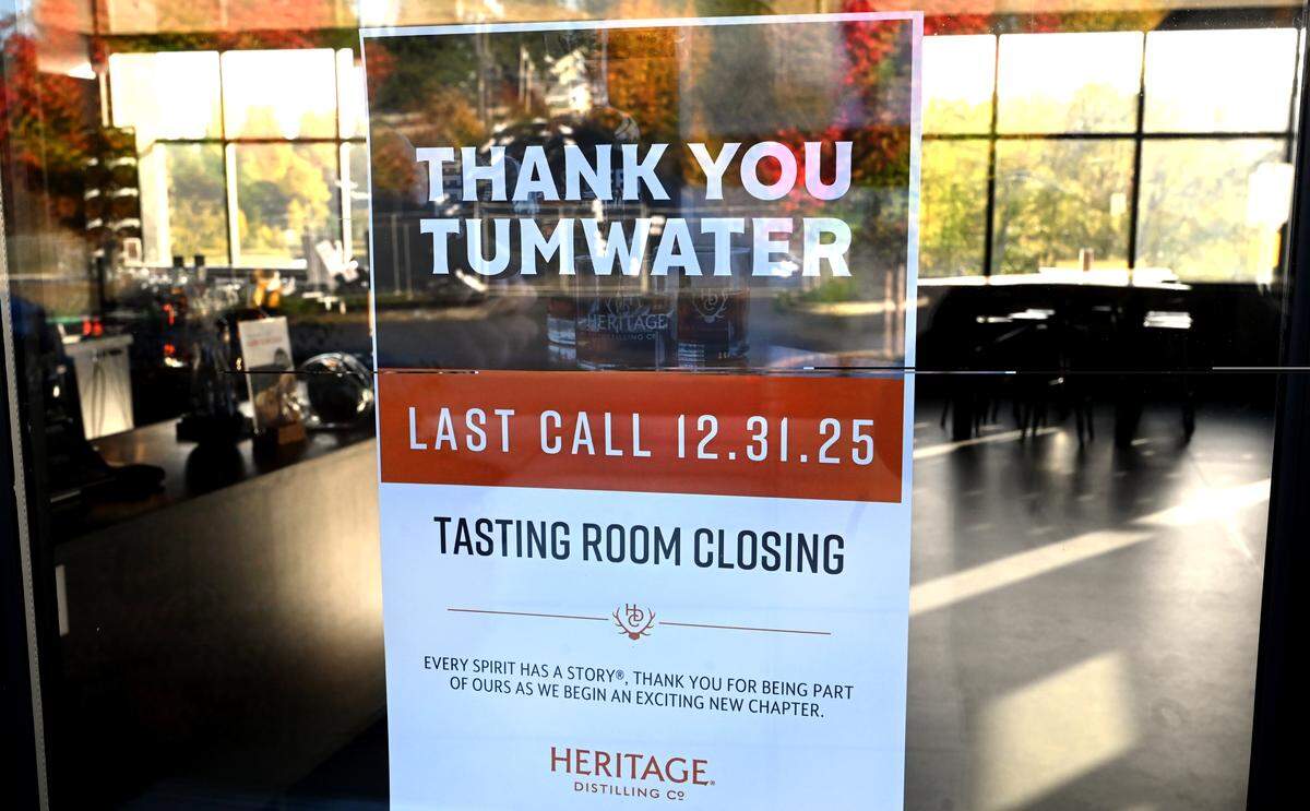A sign on the door of the Tumwater tasting room informs customers about the closure.