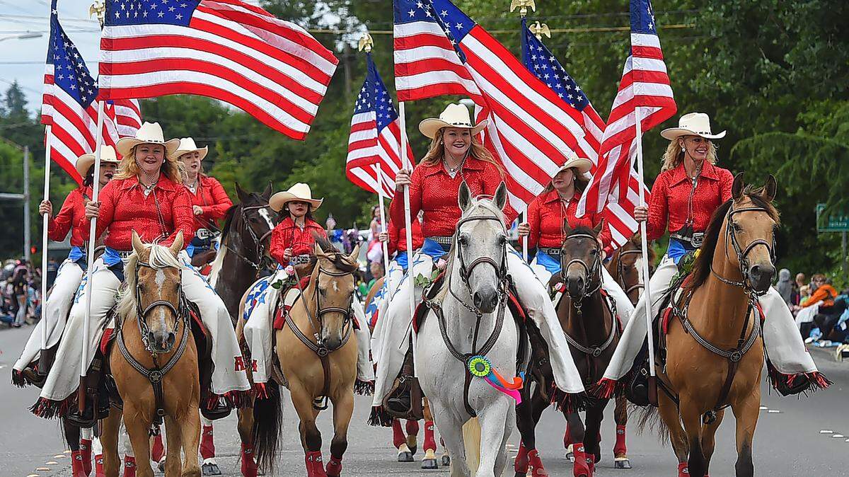 The always colorful American Made Rodeo Drill Team passes hundreds of spectators who lined Capitol Blvd. for the 34th Annual Tumwater Independence Day Parade in 2022.