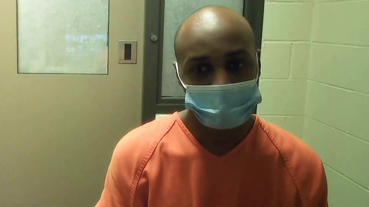 Mowlid Abdi Hersi, 31, attends his preliminary appearance in Thurston County Superior Court on Tuesday. Judge John Skinder set bail at $100,000 for Hersi who is accused of first-degree assault, second-degree kidnapping and first-degree theft. Police arrested Hersi Monday on suspicion of robbing electronics from the Olympia Target with a gun.