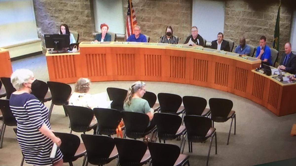 Lacey resident Lynne Dearing (left) questions Lacey City Council on Thursday about the quasi-judicial process that comes into play during hearings examiner recommendations.