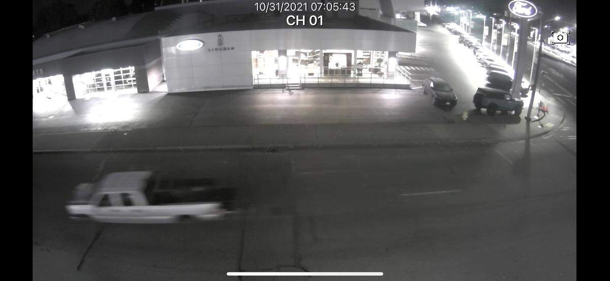 Puyallup police Sunday afternoon released a video image of one of the suspect vehicles tied to the shooting of an off-duty Federal Way police officer about 7 a.m. The vehicle is described as either a white or silver-colored 4-door Chevy pickup with dark wheels and tinted windows.