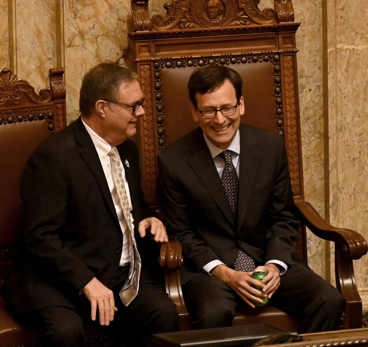 Newly-elected Washington state Gov. Bob Ferguson (right) shares a laugh with Lt. Gov. Denny Heck before addressing a joint legislative session in the House Chamber just after noon Wednesday, Jan. 15.