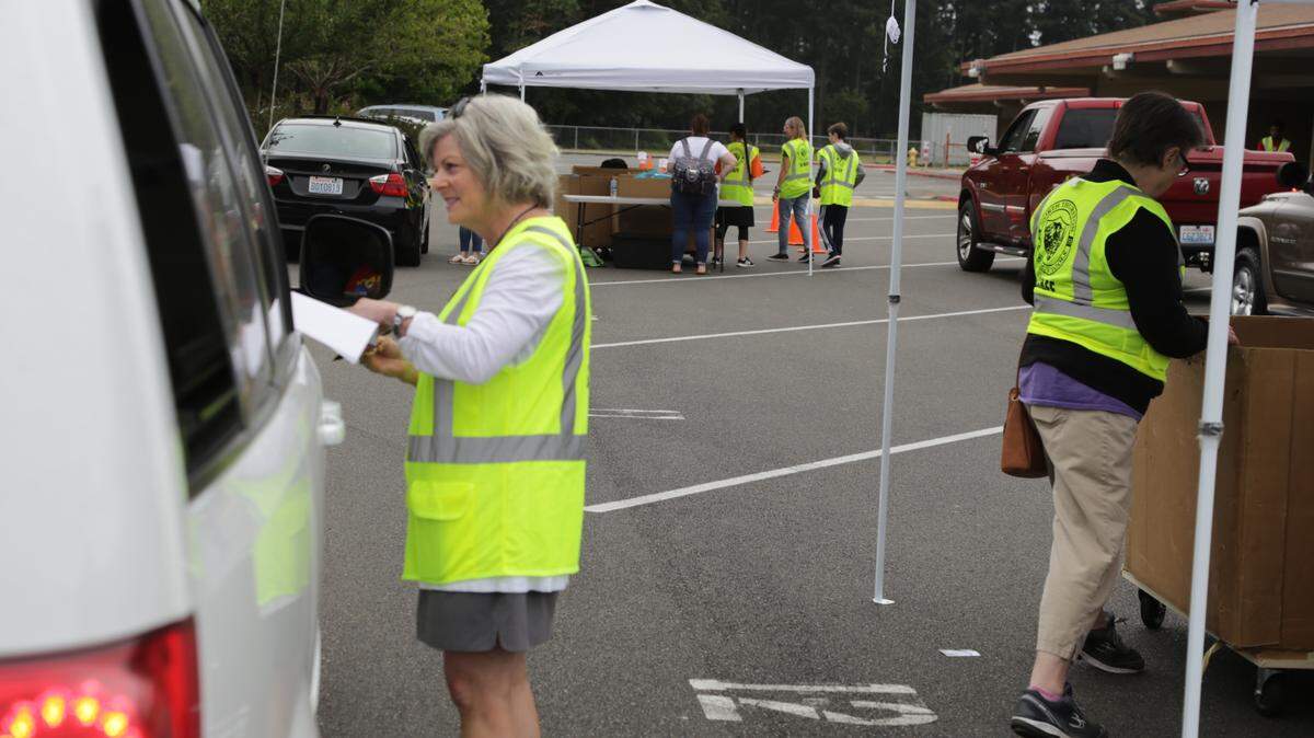 North Thurston Public Schools Superintendent Deb Clemens participating in a backpack distribution event in August 2022.