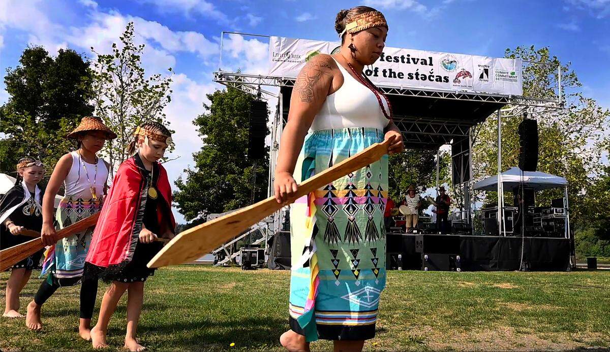 Dancers of all ages along with a tribal song and drum group welcome people to the second Festival of the st̓əč̓as celebration held in Heritage Park and along the banks of Capitol Lake in Olympia on Saturday. The festival was hosted by the Squaxin Island Tribe and the Deschutes Estuary Restoration Team to honor both the landscape and the original inhabitants of the Deschutes estuary and Budd Inlet.