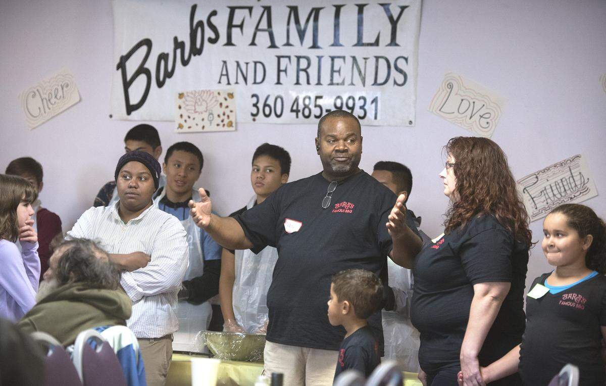 Rodney O’Neill, son of founder Barb O’Neill, welcomes guests to the 2015 Barb O’Neill’s Family and Friends free Thanksgiving meal at The United Churches in Olympia. Barb O’Neill Family and Friends will be serving barbecue food at the 2022 Capital Lakefair.