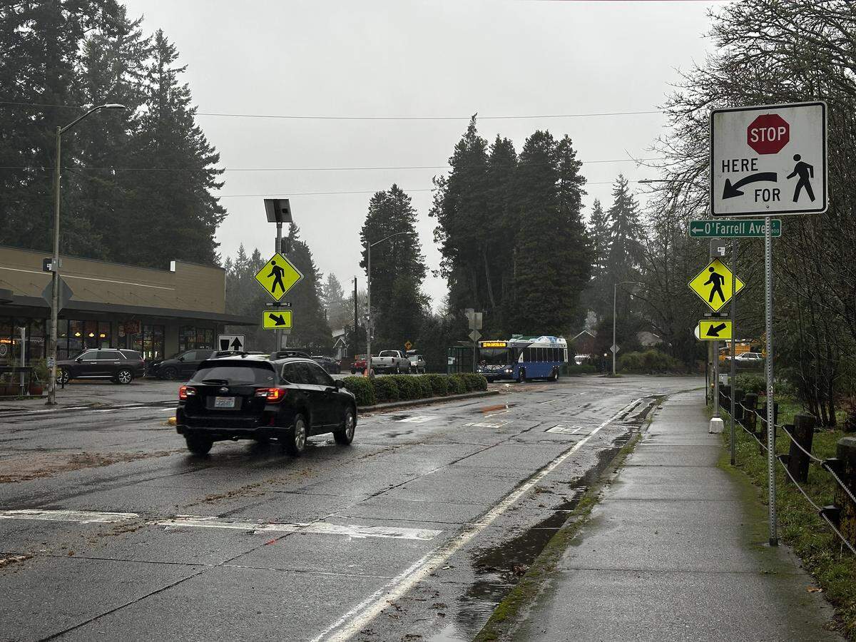 Cars pass through the crosswalk at O’Farrell Avenue and Capitol Way in Olympia on Dec. 18. The City of Olympia has plans to reconfigure the Capitol Way Corridor to reduce speeding in the area and make the neighborhood more accessible to all modes of transportation.