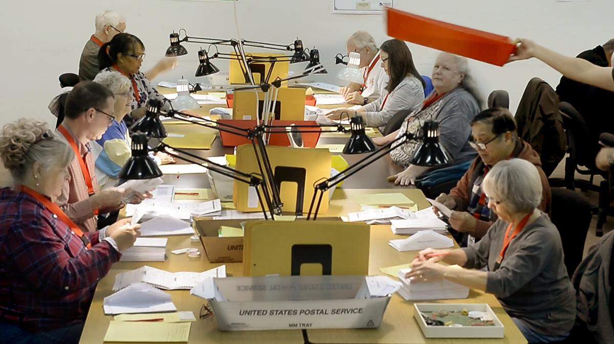 Inspectors review individual ballots at the Thurston County Ballot Processing Center in 2018. New protections will be in place for this year’s election workers.