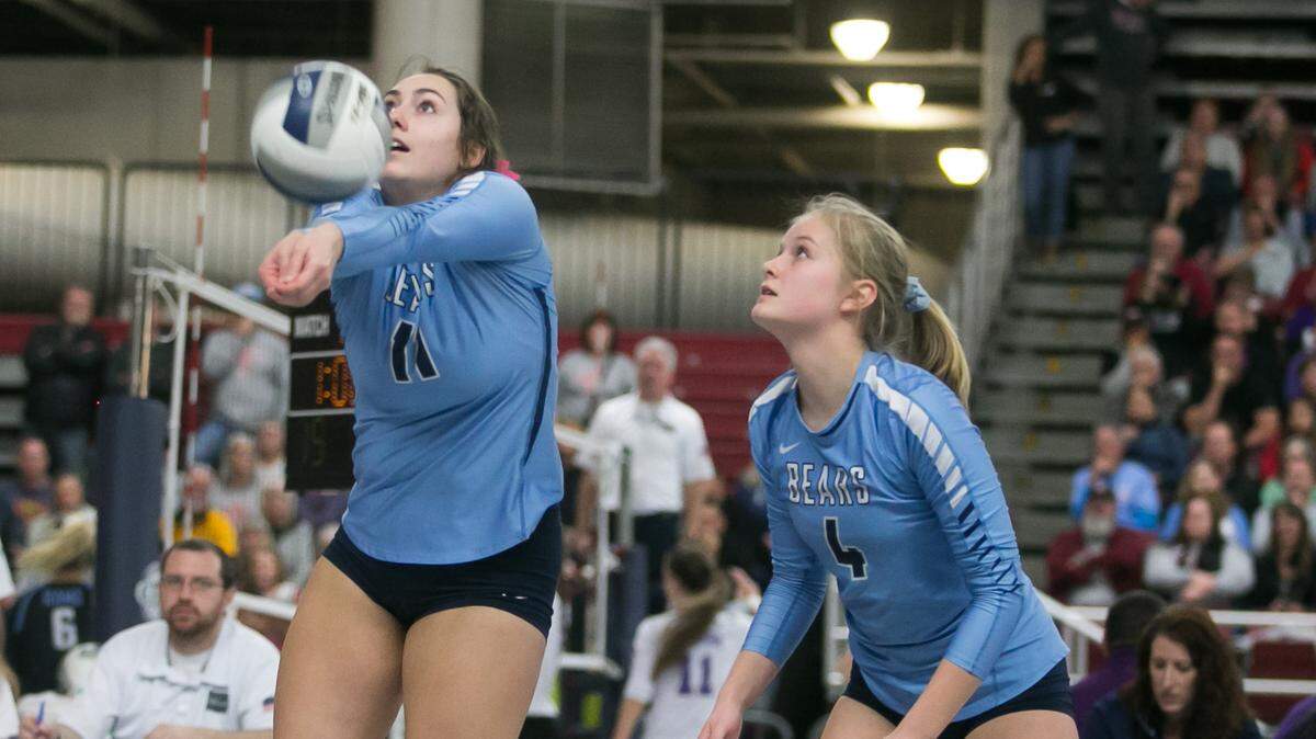 Olympia High’s Camryn Wilson (11) hits the ball against University High during a Class 4A state volleyball tournament in the Yakima Valley SunDome on Friday, Nov. 16, 2018.