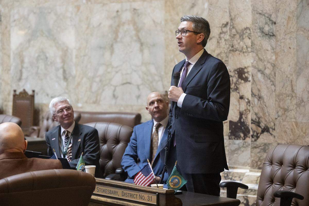 House Republican Leader Drew Stokesbary, right, speaks from the floor during the first day of the Washington state Legislature’s 60-day session on Monday, Jan. 12, 2026, in Olympia, Wash.
