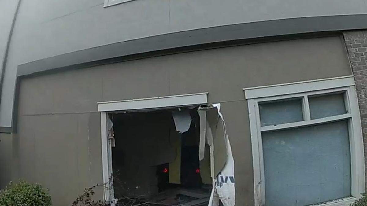 A two-car crash on Sunday sent a vehicle into a building in the 3000 block of Pacific Avenue Southeast. What appear to be red dots inside the building are the vehicle’s taillights.