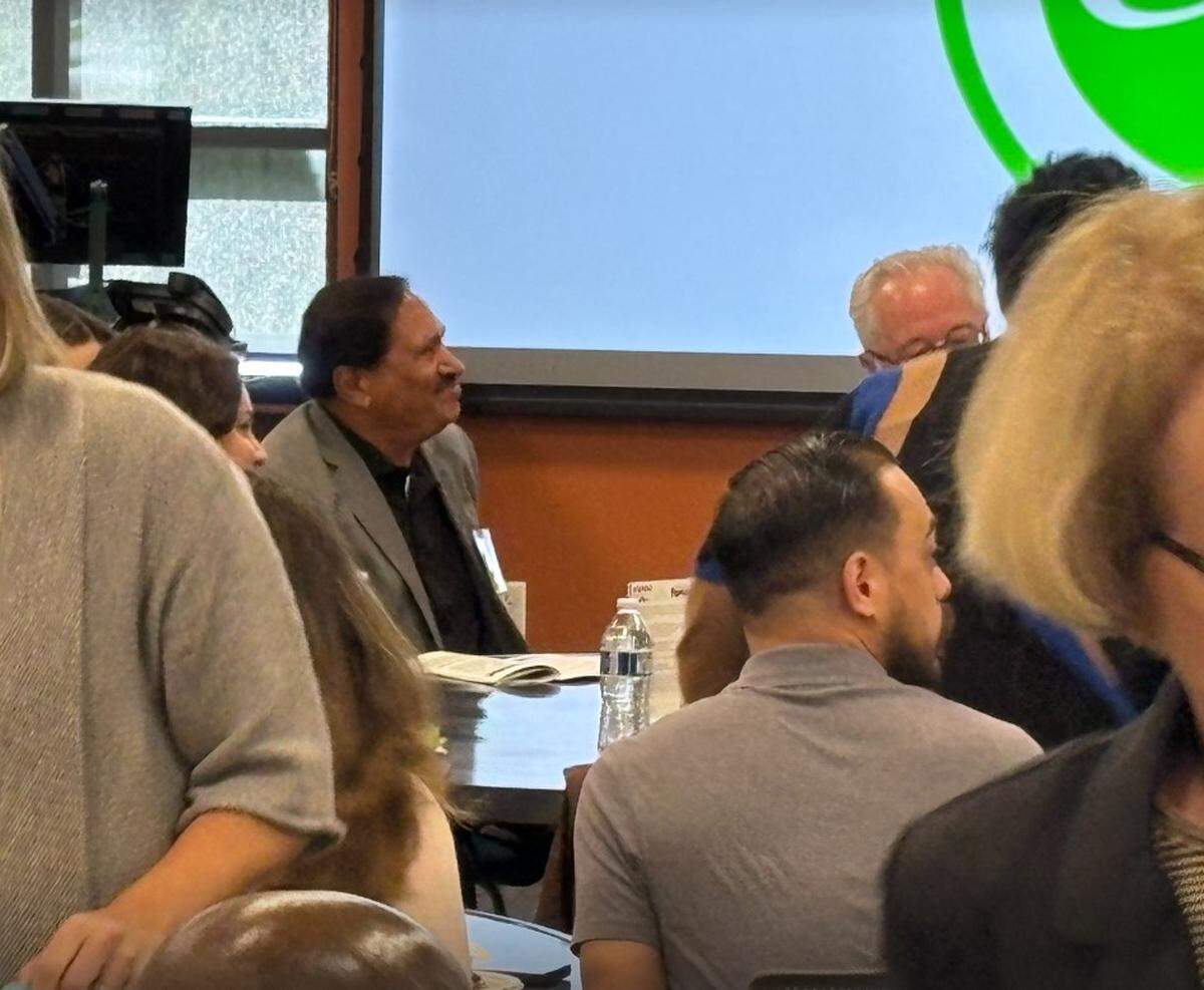 Tumwater brewery owner Chandulal Patel listens during a Thurston Economic Development Council real estate forum on Thursday.