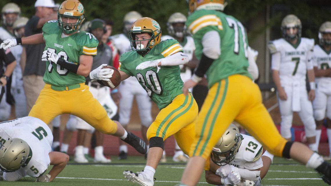 Tumwater running back Dylan Paine scampers through the Timberline defense during Friday night’s season-opening football game at Tumwater District Stadium on Sept. 6, 2019.