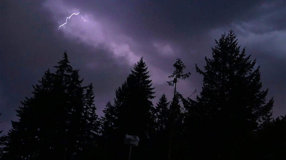 A lightning flash can be seen over Rainier early Tuesday morning.