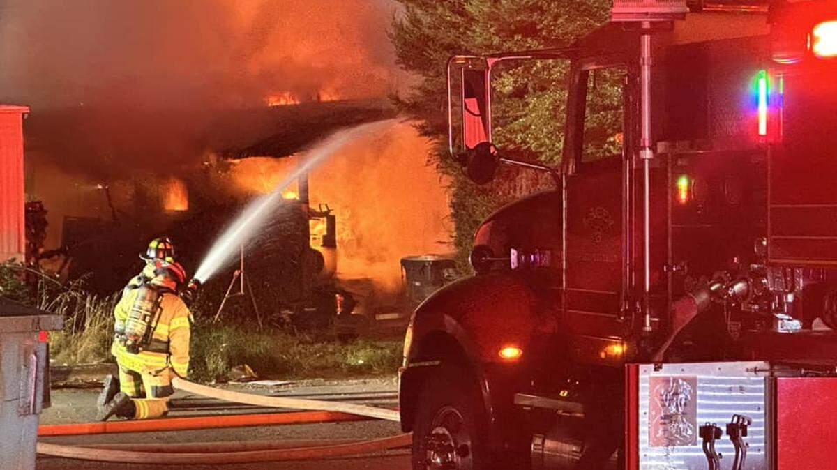 Lacey Fire District 3 crews fight a mobile home park fire Friday night near Lacey.