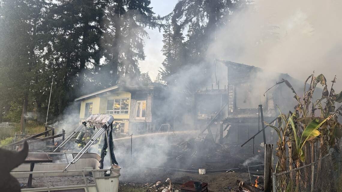 Thurston Co. Sunday house fire spread to tree, neighboring home, officials say