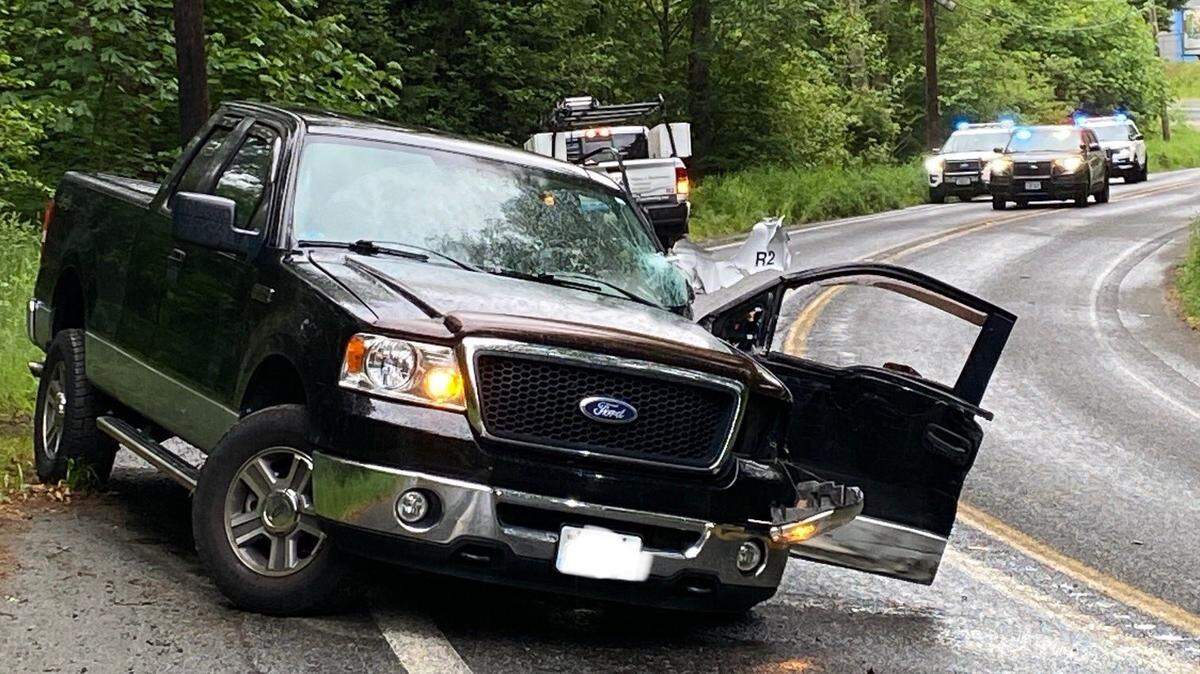 A Ford pick-up truck rests on the westbound lane of State Route 106 in Mason County after a collision with another vehicle on Tuesday, May 28, 2024. The driver of the truck, a 51-year-old Port Orchard woman was airlifted to Harborview Medical Center in Seattle with injuries, according to Washington State Patrol.