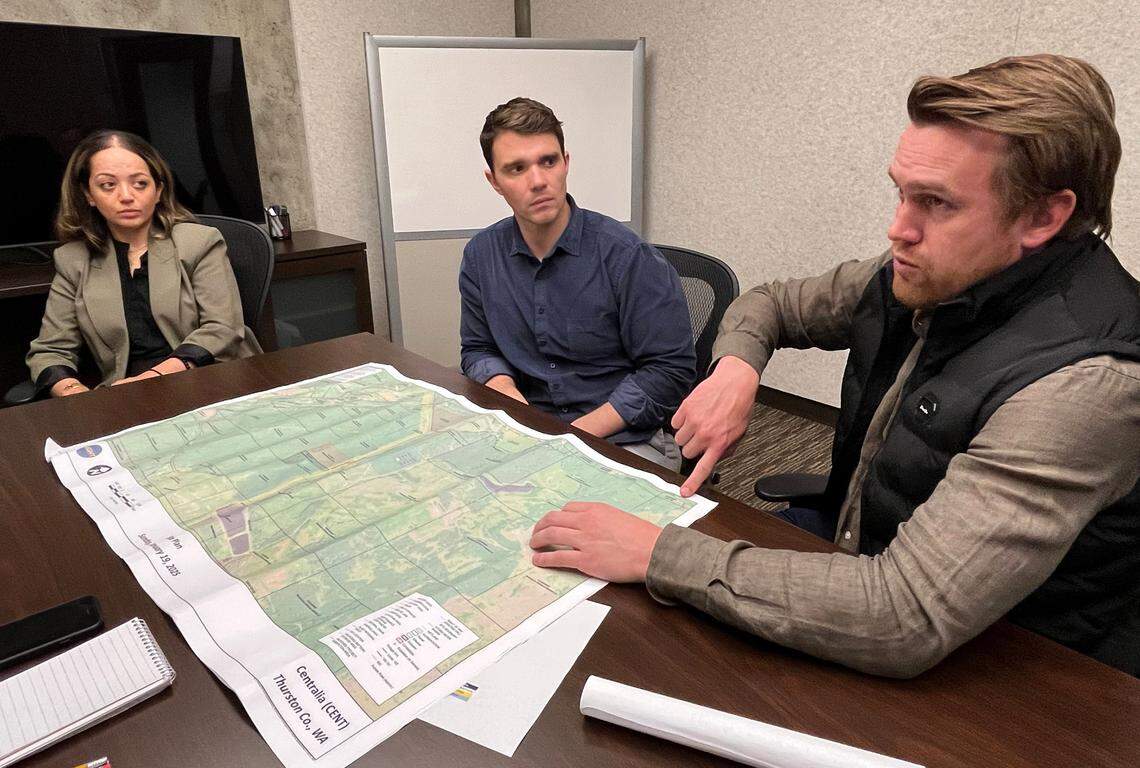 At an April 23 interview, Greg Vander Kamp, vice president of development for BrightNight, describes the location of the Thurston County proposal as consultant Austin Hicks and development communications manager Yasmine Kattan listen.
