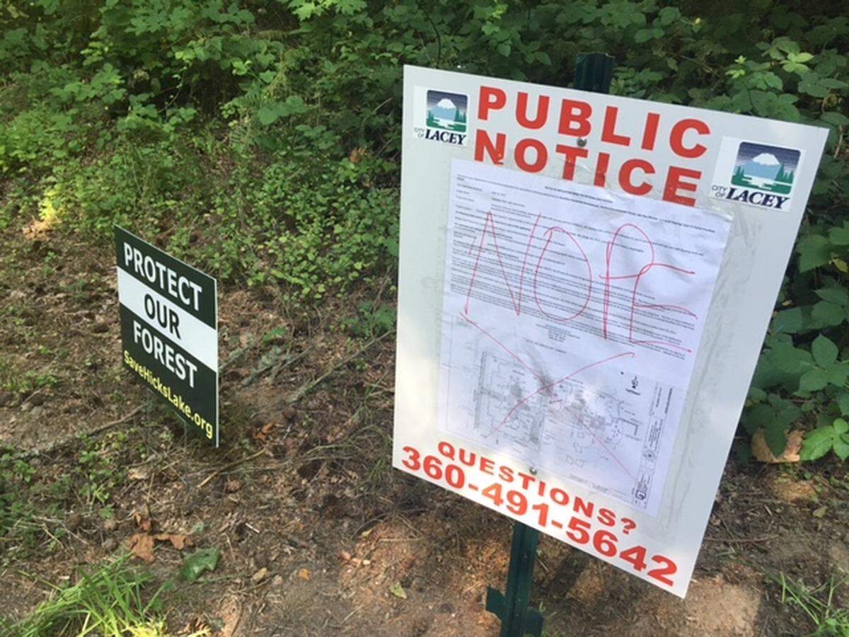 There has been neighborhood opposition to the apartment proposals on Hicks Lake, including on this city of Lacey project notice sign. Over the summer, someone had crossed out the image and wrote “nope.”