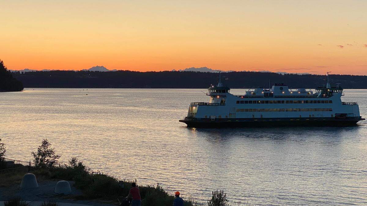 A Washington State Ferry makes its way from Vashon Island to Tacoma at sunset in August 2024.