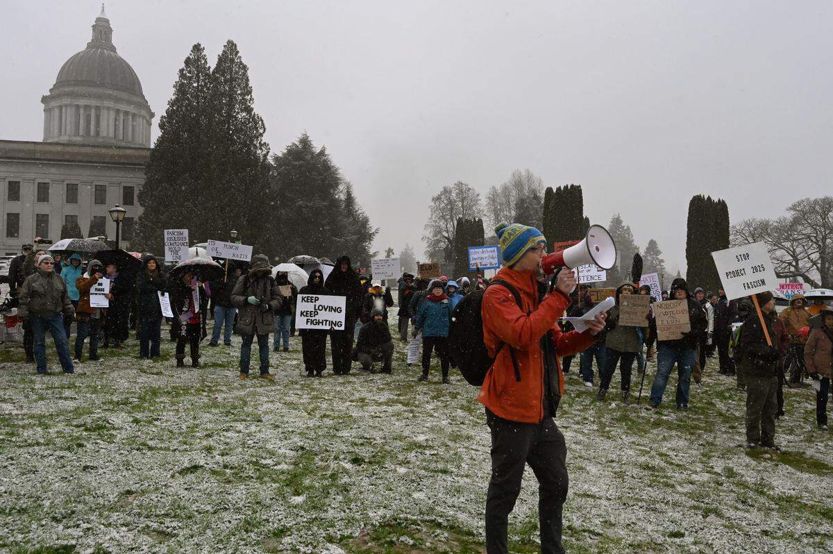 Speaking to hundreds of protesters at a noon rally at the Capitol in Olympia, Wa. Zane Gustafson, author of the book “Polemic for Democracy,” share his fears regarding the current administration and his opposition to President Donald Trump’s Project 2025 agenda and specifically, Elon Musk.