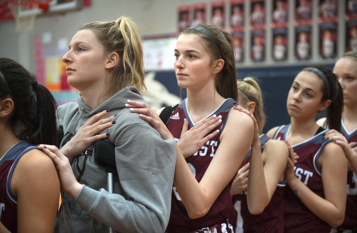 W.F. West freshman guard Drea Brumfield (center) had one season to play basketball with her big sister, senior Erika Brumfield (left) in 2018-19, until Erika injured her knee. But they still are side-by-side, shown before a girls basketball game at Black Hills High School in Tumwater on Jan. 16, 2019.