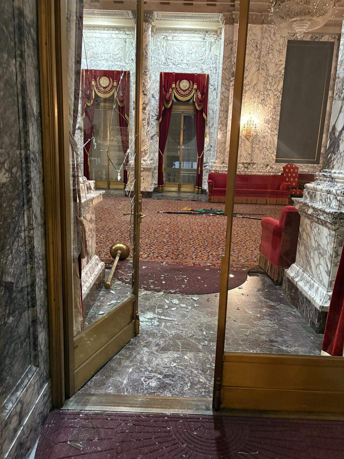 A glass door leading to the State Reception Room was shattered by an intruder who broke into the state Capitol building on Oct. 5, 2025.