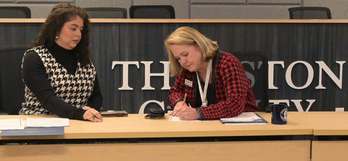 Thurston County Auditor Mary Hall verities the 2023 election as County Commission Carolina Mejia looks on before a Nov. 28, 2023 swearing-in ceremony at the Atrium building in Olympia which houses county services.