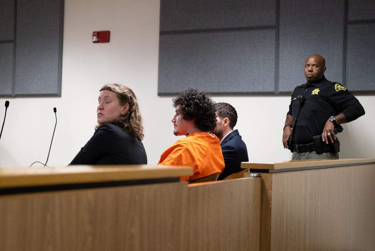 Kevin Hinzpeter, 32, (center) listens to Judge Christopher Lanese during his sentencing hearing on Monday, Nov. 17, 2025, in Thurston County Superior Court. Hinzpeter pleaded guilty to second-degree murder for the death of Zebediah Schoening, a 47-year-old former resident of “The Jungle” on Martin Way East in Olympia.
