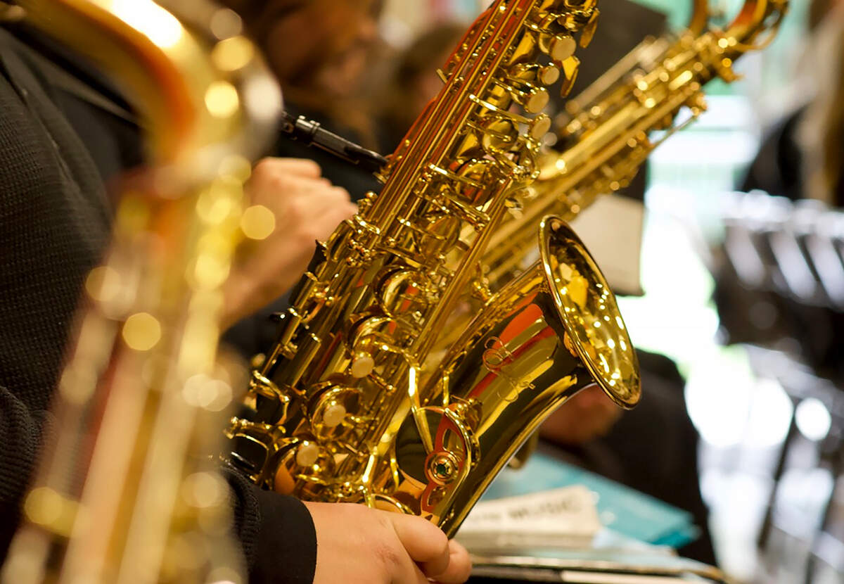Students play the saxophone
