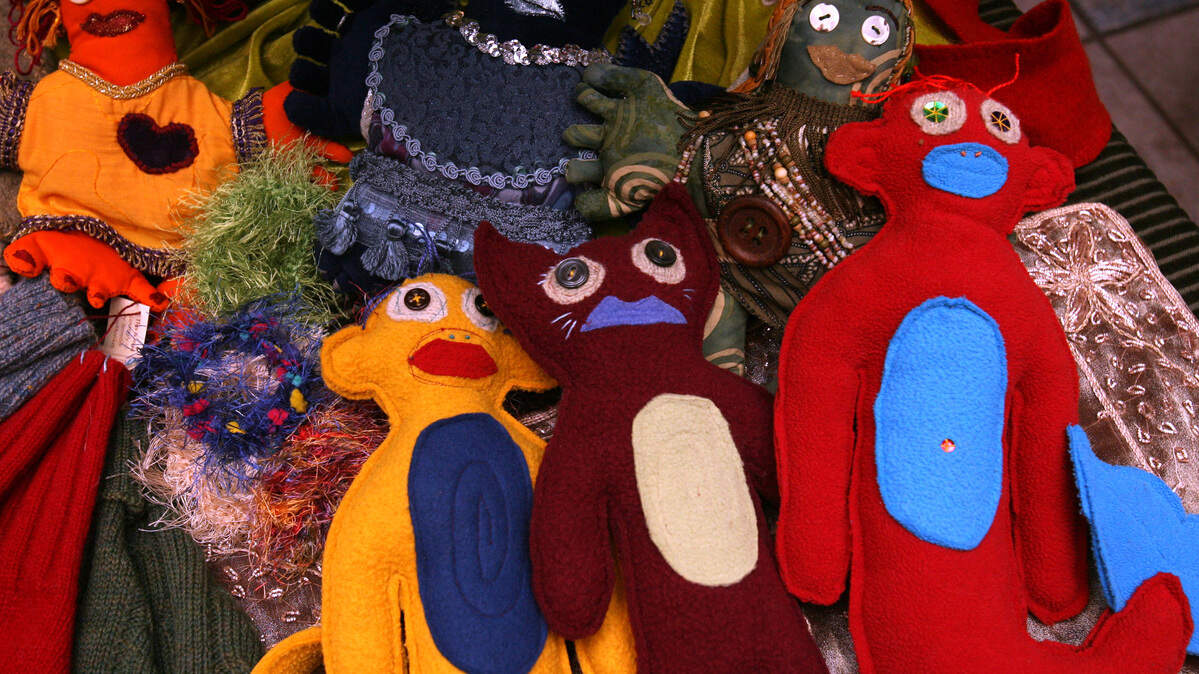 Felt monkeys and cats by artist Jennifer Kuhns of Cosmic Monkey Productions. (Tony Overman/The Olympian)