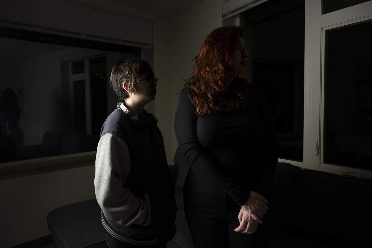 Vincent and his mother, Melinda Ramirez, stand in their apartment on January 14, 2026, in Seattle, Wash. The pair moved to Seattle from Houston in December 2024, in the wake of Texas’ ban on gender-affirming healthcare.