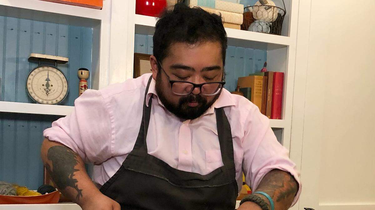Instructor Jay Guerrero carving up a duck from the Duck a l’Orange class offered online by The Pantry in Seattle.