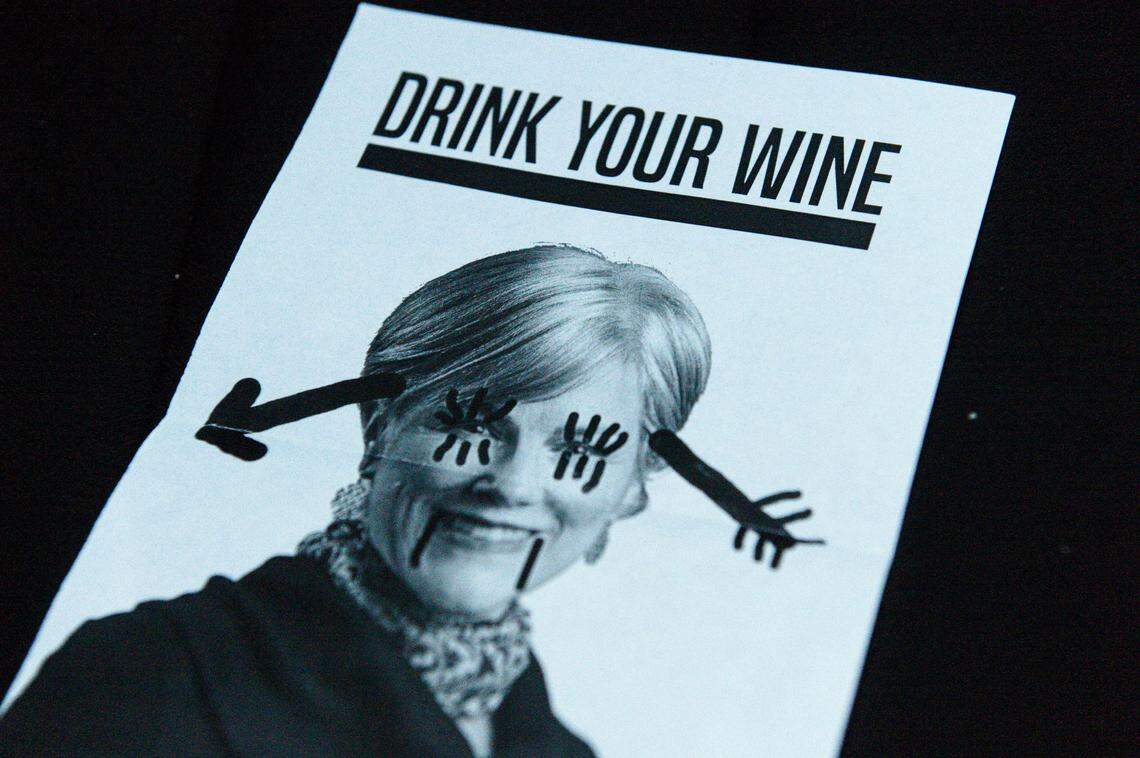 Several fliers depicting Olympia Mayor Cheryl Selby were scattered near her residence by a group of about 30 masked protesters on Tuesday, May 1, 2018.