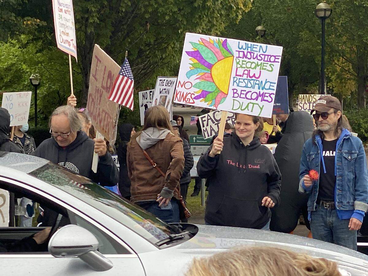 At a few points, cars were intentionally cruising along Capitol Way to show support, honking and stopping to share encouragements with those lining the street. They also clogged traffic along the arterial.