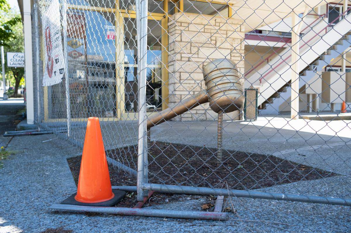 A golden gavel still stands at the Olympian Inn on Capitol Way, a visual reminder of the historic name of the motel. Interfaith Works has decided to rename the building to Sandy’s Flats once it becomes permanent supportive housing.
