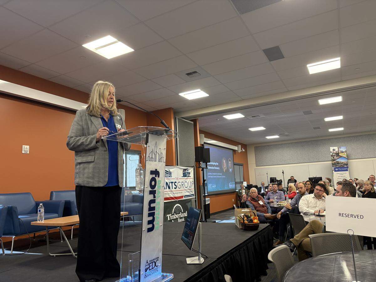 Tumwater Administrator Lisa Parks discusses the city’s plan for the former brewery property during a presentation at the Thurston Economic Development Council’s real estate forum on Thursday.