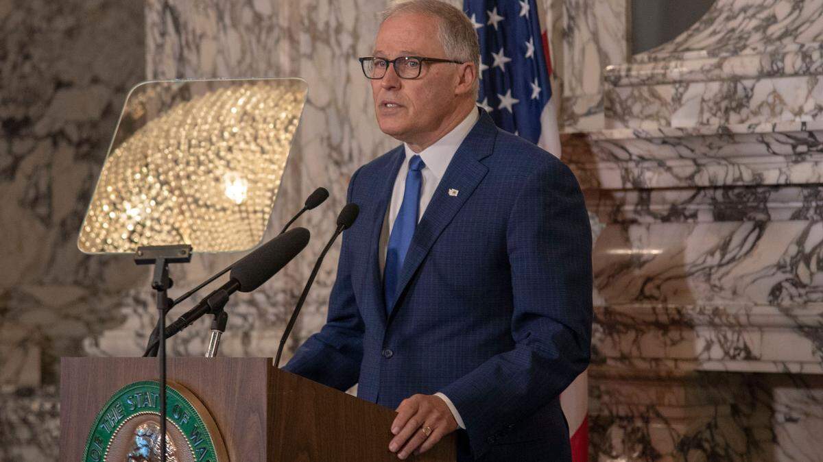 Gov. Jay Inslee calls for action from the legislature when he gave his annual State of the State speech at the Capitol in Olympia Tuesday, Jan. 11, 2022, before an audience kept small due to concerns about transmission of the omicron variant.