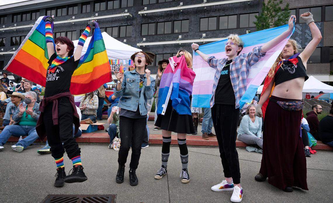 Alex Marin-Autry (from left), Hazel Tomita, Vixen Deschenes, Keegan Robel and Stella Artemis cheer on pop punk singer Haley Graves during the Capital City Pride festival at the Port Plaza in downtown Olympia, Washington on Saturday, June 4, 2022.