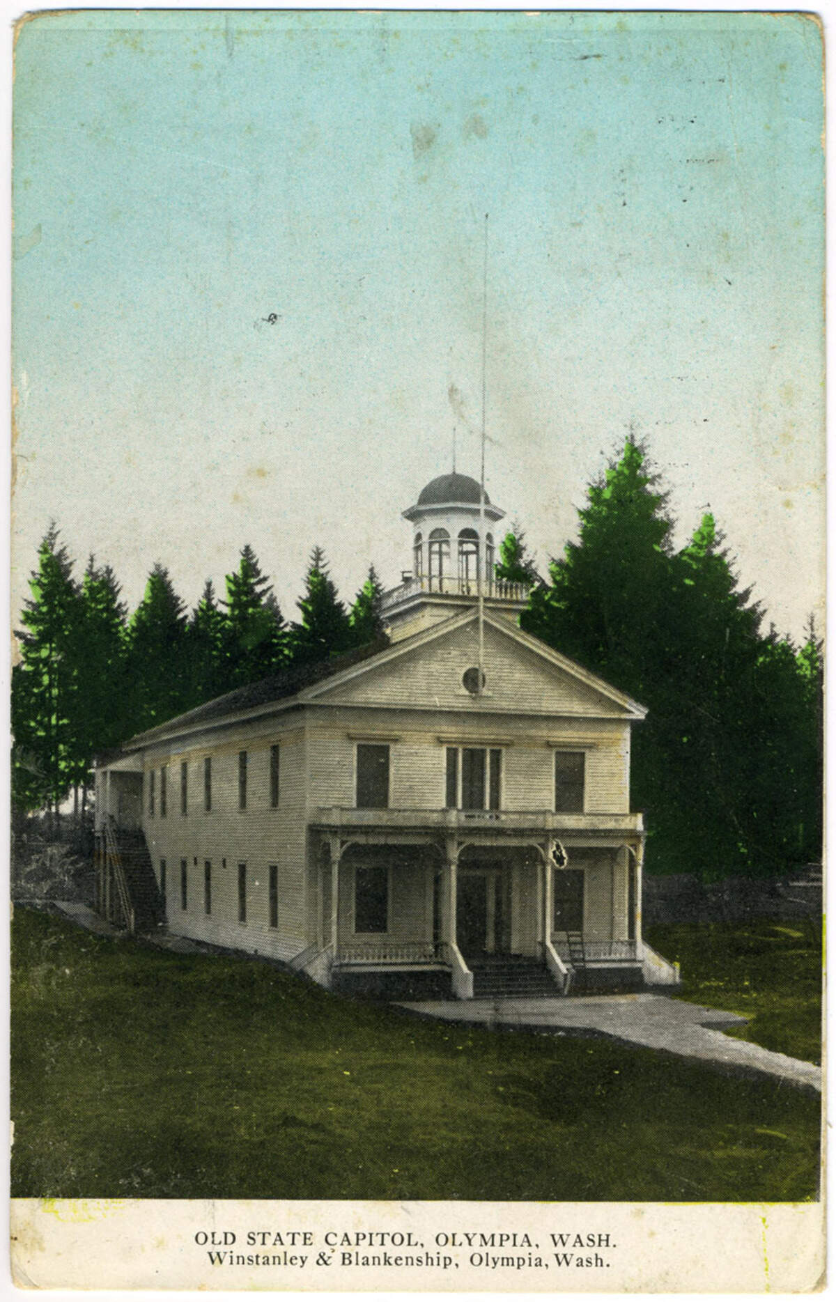 The partnership between Blankenship and Winstanley also produced postcards featuring local scenes. This photographic postcard, labeled “Old State Capitol,” was taken in the early 1900s, before its demolition to make way for the current Legislative Building.