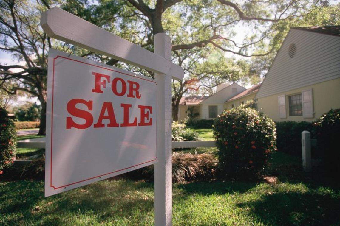 A “for sale” sign is displayed outside of a home. Washington state law does not require sellers to disclose if deaths, murders or other violent crimes occured on a property. 