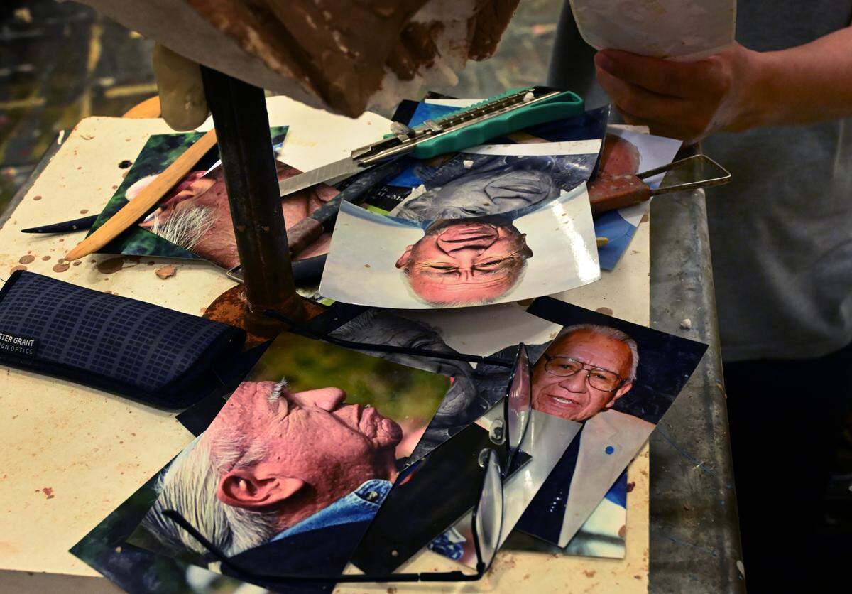 Working in the stage room of the Minnaert Center for the Arts at South Puget Sound Community College on June 7, 2024 Seattle artist Haiying Wu continues his sculpting of the Billy Frank Jr. statue destined for the National Statuary Hall.