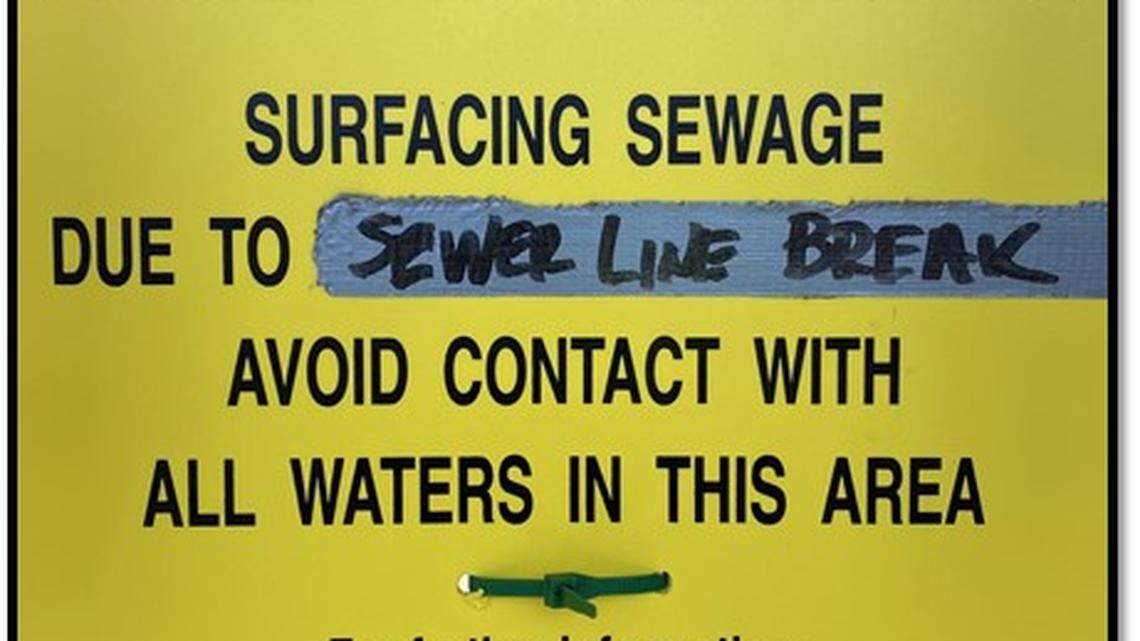 An example of signs posted in the area of Percival Creek in west Olympia after raw sewage spilled into the creek over the weekend.