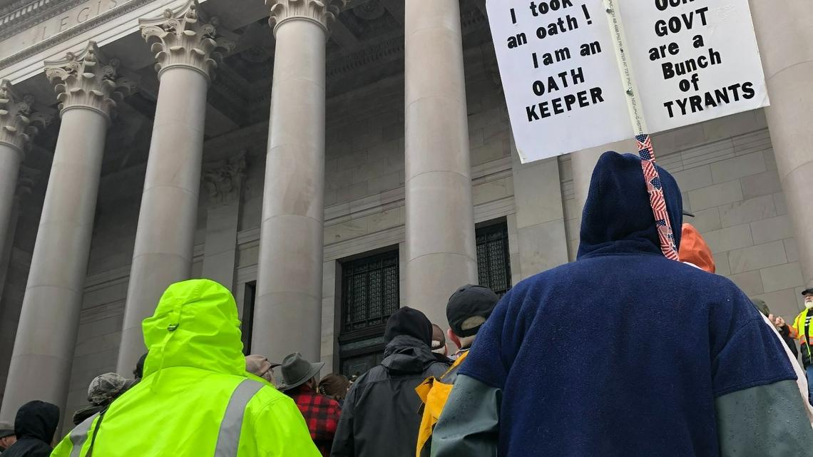 Visitors and Oath Keepers open carry weapons at the state capitol on Jan. 31, 2020 during a rally. Legislation passed in 2021 now prohibits weapons within 250 feet of state capitol grounds and permitted demonstrations.