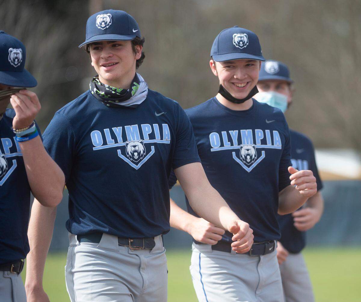 Olympia senior pitcher/infielder Aiden Herrick (left) and junior pitcher/outfielder Rylan Haider are expected to lead the Bears as they contend for a 4A SPSL title. They are shown before baseball practice at Olympia High School on Friday, April 2, 2021.