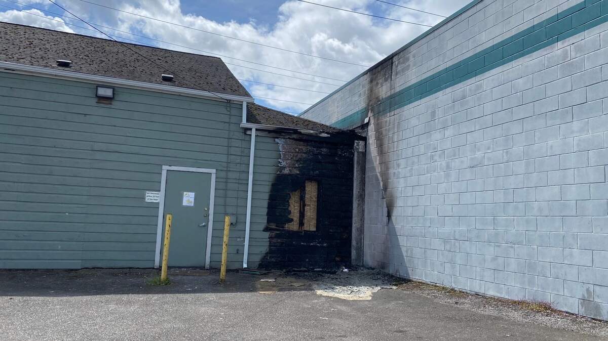 A fire early Saturday on the backside of Gloryhouse Foursquare Church on Legion Way originated near a portable restroom that already was completely destroyed when firefighters arrived.